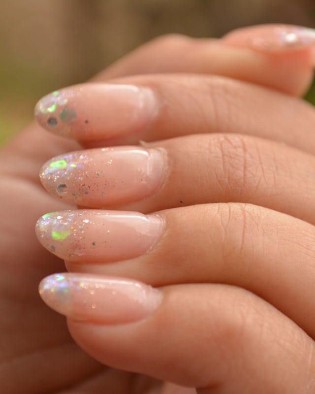 Long almond nails with a fine glitter gradient from the tips